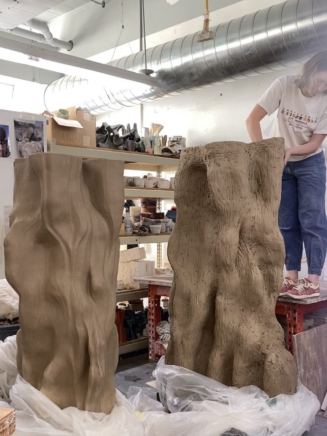 Sara Jensen working on a large sculpture