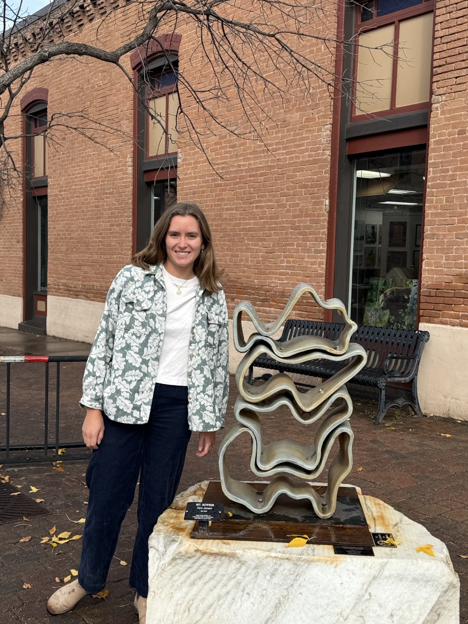 Sara Jensen '19 with one of her sculptures displayed in Carbondale